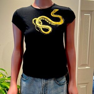 T-shirt with gold snake with ruby eye.